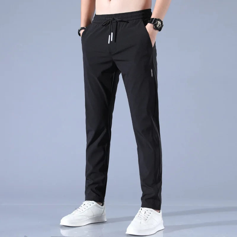 Calça esportiva masculina de seda gelada, cor sólida, cintura média, solta, respirável, perna reta, calça casual, fina, secagem rápida